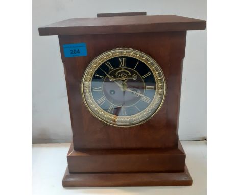 A late 19th Century mantle clock with a visible bracket escapement in a mahogany case. Location:10:1 