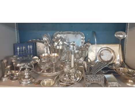 Mixed silver plated and silver coloured items to include an Italian Dansk ladle, mixed cutlery, three trays, goblets and a ca