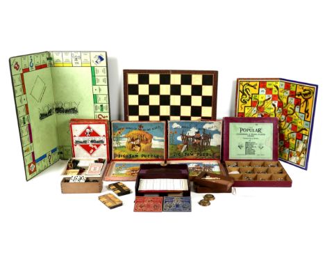 A group of vintage games, including a leather cased Piquet and Bezique set, with Goodalls' gold medal playing cards, Thomas d