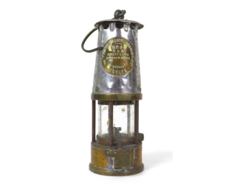 An early 20th century Protector Lamp & Lighting Co. Ltd. safety lamp, GR6, with brass and white metal fittings, used in the y