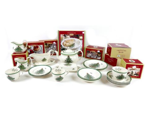 A collection of Spode 'Christmas Tree' Tableware, including a teapot, plates, gravy boat and liner, teacups, mugs, butter dis