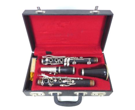 A Boosey & Hawkes rosewood five piece clarinet, with white metal mounts, serial number '173867' and fitted hard case, 67.5cm 