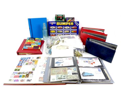 A collection of 19th century receipts and stamped ephemera, a 20th century album of stamps, four albums of first day covers, 