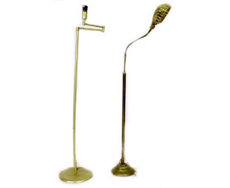 A group of three standard lamps, comprising two brass reading lamps, and a wooden standard lamp on a tripod base, 50 by 50 by
