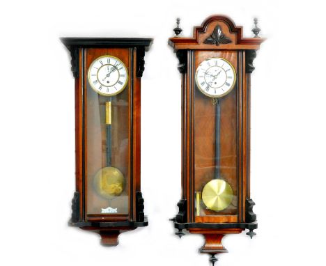 Two 20th century Vienna wall clocks in need of restoration, each with enamel dial, single weight and pendulum, both with keys