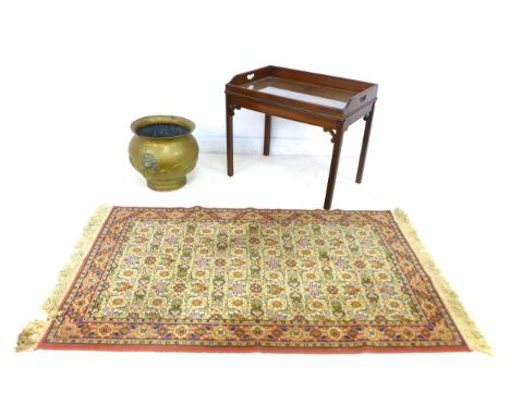 A mixed group of furniture, comprising a brass planter with twin lion head mask handles, 47 by 42 by 39cm high, a mahogany bu