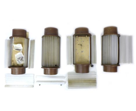 Four Art Deco wall light shades, each consisting of individual tubular glass inserts fitted within semi cylindrical form bron