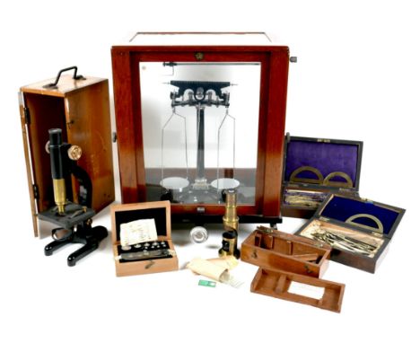 A group of scientific instruments, including a vintage set of Baird & Tatlock laboratory scales, 35 by 23 by 44cm high, a col