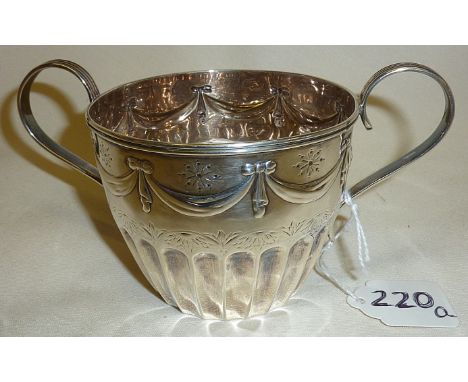 Victorian silver porringer decorated with repousse swags and engraving. Hallmarked London 1881 and by Henry Wilkinson &amp; C