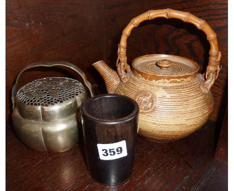 Chinese studio pottery stoneware teapot, a metal cricket cage, and a turned ebony pot