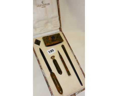 1920s Art Deco Staedtler marbled bakelite desk set consisting of dip pen, blotter, pencil, seal, paperknife, and lidded inkwe