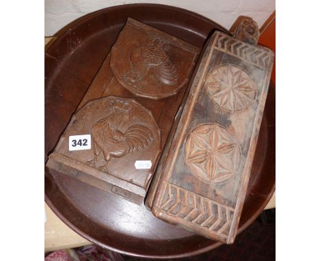 Carved wood sliding book rack, a large wood bread tray and an ethnic carved wood spice box