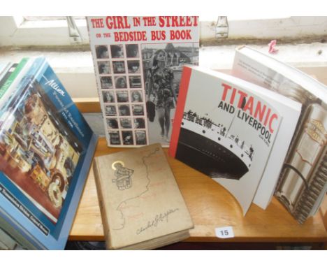 Shelf of transport-related books, including the "Bedside Bus Book", and an 1893 First Edition "From Paddington to Penzance" b