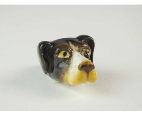 A Royal Worcester porcelain dog's head whistledated 1922, nicely modelled with painted features, printed factory mark in puce
