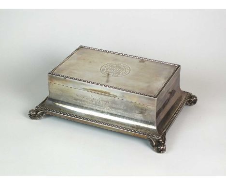 A Goldsmiths &amp; Silversmiths Co Ltd silver mounted presentation cigar box, London 1945, of tapering rectangular form with 