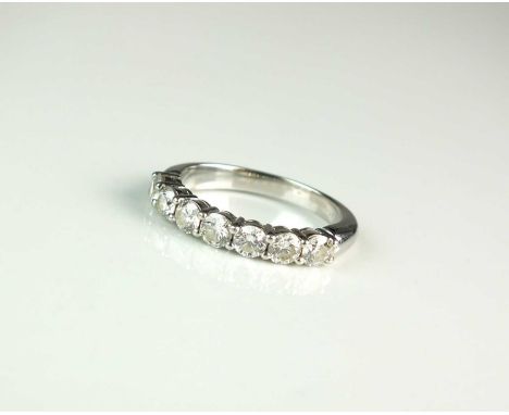 A Tiffany &amp; Co platinum seven stone diamond ring, designed as a row of seven brilliant cut diamonds all claw set in plati