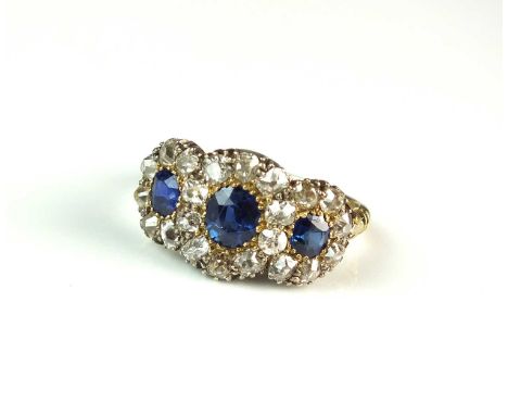 A 19th century sapphire and diamond ring, designed as three oval-round mixed cut sapphires each claw set in yellow metal with