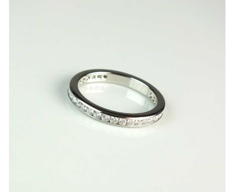 A Tiffany &amp; Co platinum diamond set eternity ring, the band comprising thirty-six brilliant cut diamonds all channel set 