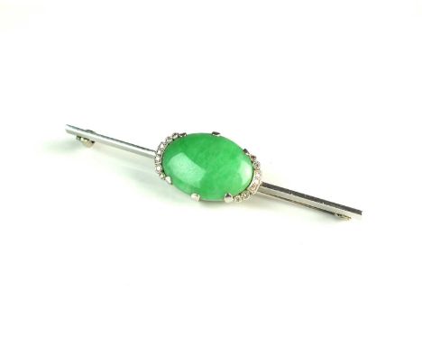 A jade and diamond bar brooch, designed as an oval cabochon jade claw set within a partial border of milligrain set diamonds,