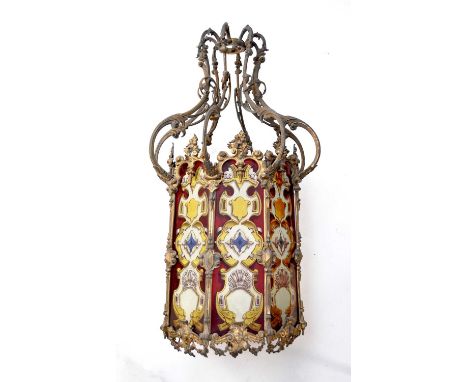 A Victorian gilt metal hall lantern, of octagonal form, with foliate scroll arms connecting the upper 'crown' with the main b