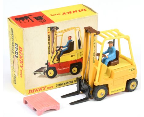 Dinky Toys 404 Conveyancer Fork Lift Truck - Deep yellow body, yellow plastic inner and cage, brown seat and trim, black fork