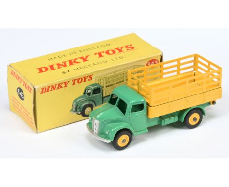 Dinky Toys 343 Dodge Produce Wagon - Mid-green cab and chassis, yellow stake back and plastic hubs with treaded tyres, silver