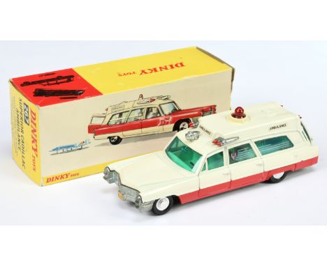 Dinky Toys 267 Superior Cadillac "Ambulance" - White body, red lower sides, green tinted windows, red battery operated roof l