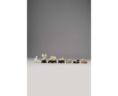 SEVEN CHINESE JADE CARVINGSQING DYNASTYComprising: animals, birds and a bat in white, celadon and russet jade, together with 