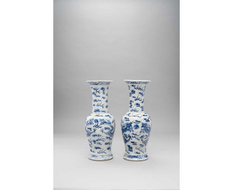 A NEAR PAIR CHINESE BLUE AND WHITE 'DRAGON' VASES 19TH CENTURYEach decorated with two dragons contesting pearls amidst clouds
