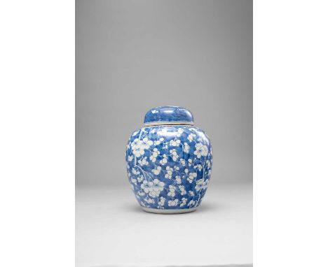 A CHINESE BLUE AND WHITE PRUNUS JAR AND COVER KANGXI 1662-1722Typically decorated with blossoming prunus on a cracked-ice gro