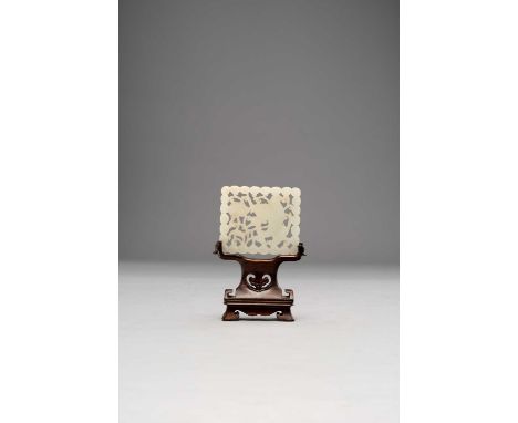 A CHINESE WHITE JADE RECTANGULAR PLAQUE17TH/18TH CENTURYPierced and carved with a crane holding a peach spray in its beak sur
