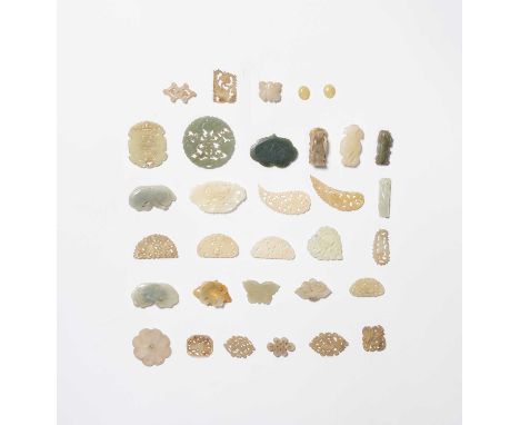 A COLLECTION OF THIRTY TWO CHINESE SMALL JADE ITEMS QING DYNASTY AND REPUBLIC PERIOD  Variously carved as animals, insects, f
