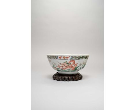 A CHINESE FAMILLE VERTE 'DRAGON' BOWLKANGXI 1662-1722Painted with dragons and carp emerging from foaming waves, the interior 