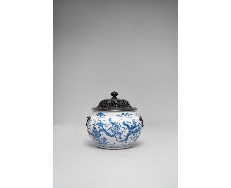 A CHINESE BLUE AND WHITE VESSEL KANGXI 1622-1722The compressed circular body painted with fish, waterweed and crustacea, the 