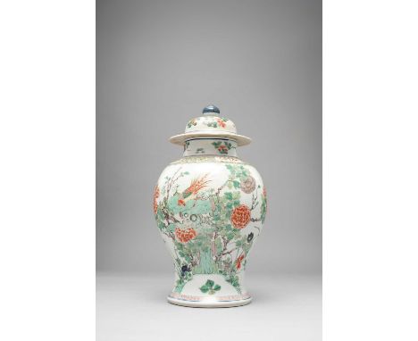 A CHINESE FAMILLE VERTE BALUSTER VASE KANGXI 1662-1722Painted with a long tailed bird on rockwork and butterflies in flight a