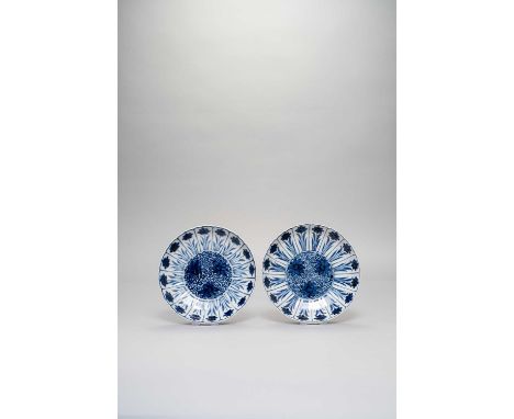A PAIR OF CHINESE BLUE AND WHITE MOULDED 'LOTUS' DISHESSIX-CHARACTER KANGXI MARKS AND OF THE PERIOD 1662-1722Decorated with f
