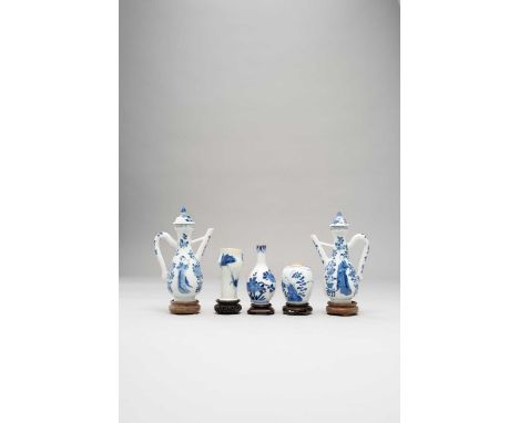 TWO CHINESE BLUE AND WHITE EWERS AND COVERS AND THREE SMALL BLUE AND WHITE VESSELS THE EWERS KANGXI 1662-1722The ewers of lob
