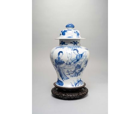 A CHINESE BLUE AND WHITE 'LADIES' BALUSTER VASE AND COVERKANGXI 1662-1722Painted with ladies admiring a scroll painting and p