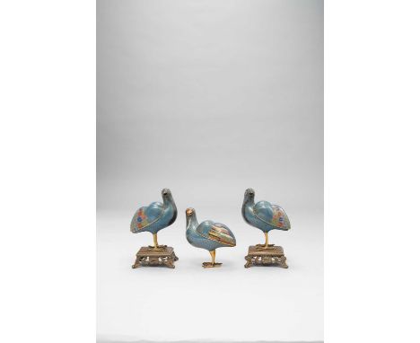 THREE CHINESE CLOISONNE ENAMEL MODELS OF QUAILQING DYNASTYComprising: a pair with their heads turned to the side and raised o