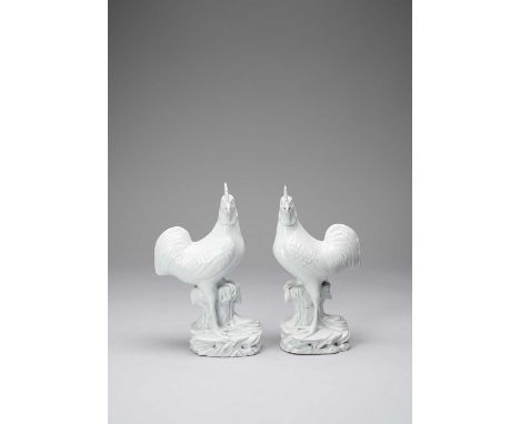 A PAIR OF CHINESE BLANC DE CHINE MODELS OF COCKERELSKANGXI 1662-1722Standing proudly on rocks with their heads to the side, t