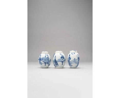 THREE CHINESE BLUE AND WHITE OVOID JARS AND COVERSKANGXI 1662-1722Each decorated with young ladies engaged in various pursuit