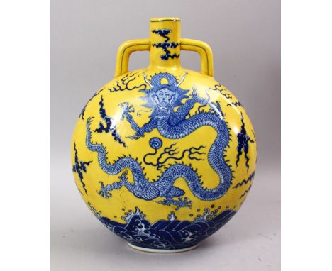 A GOOD CHINESE FAMILLE JAUNE BLUE &amp; WHITE PORCELAIN DRAGON MOON FLASK, the yellow ground bearing an imperial dragon, with