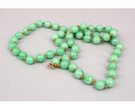 A GOOD SET OF APPLE GREEN CHINESE JADE BEADS, 66CM.