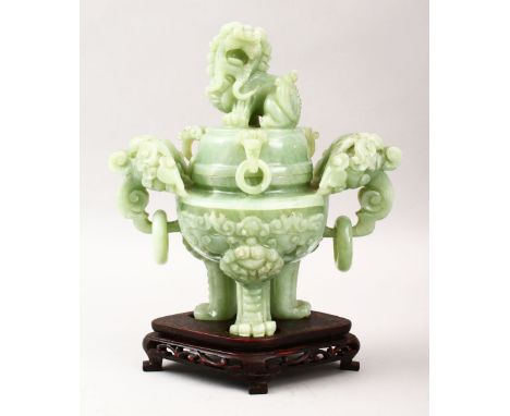 A GOOD CHINESE CARVED JADE TRIPOD CENSER, COVER &amp; STAND, the censer carved with twin lion dog handles with further mouldi