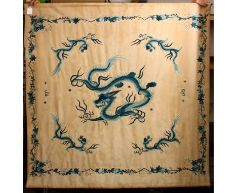 A GOOD 19TH / 20TH CHINESE EMBROIDERED SILK  / TEXTILE SCROLL OF DRAGONS, the embroidery depicting one larger central dragon 