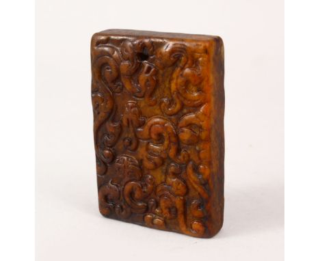 A GOOD CHINESE 19TH / 20TH CENTURY CARVED JADE PENDANT OF CHILONG, the heavy stone pendant carved in archaic style with chilo