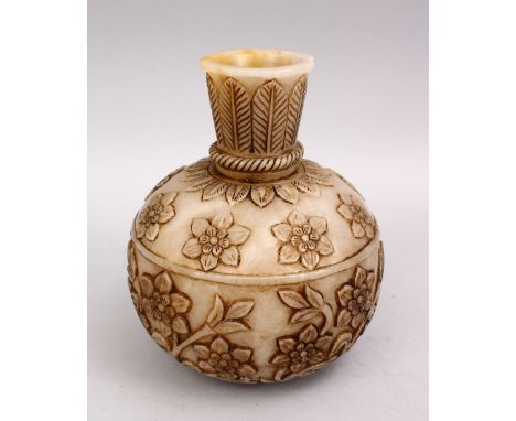 A HEAVY INDIAN MUGHAL CARVED JADE FLORAL VASE, the body of the vase with floral carved decoration, 21cm.