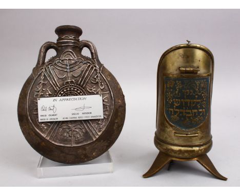 TWO GOOD BRASS &amp; STONEWARE JEWISH RELATED ITEMS, one flask shaped stone bottle with silver inlays, with a plaque that pur