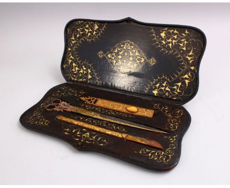 A FINE SET OF BOXED TURISH / ISLAMIC GOLD INLAID STEEL CALLIGRAPHY TOOLS, scissors 28cm, presented in gilt decorated box.