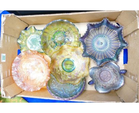 A collection of darker coloured carnival glass item to include: commemorative plates, footed bowls, ruffled edge pieces etc 